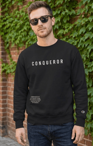 Man wearing black Conqueror Christian sweatshirt Champion crewneck