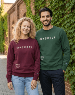Men and women wearing Conqueror Christian sweatshirts
