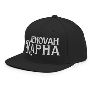Man wearing black Jehovah Rapha flat bill trucker hat