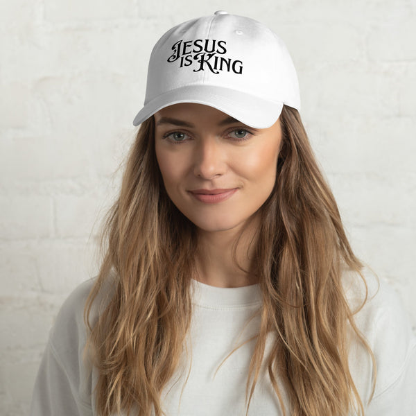 Woman wearing white Jesus Is King women’s dad hat