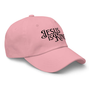 Angled view of pink Jesus Is King women’s dad hat
