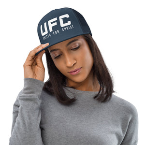 Woman wearing navy UFC United for Christ trucker cap