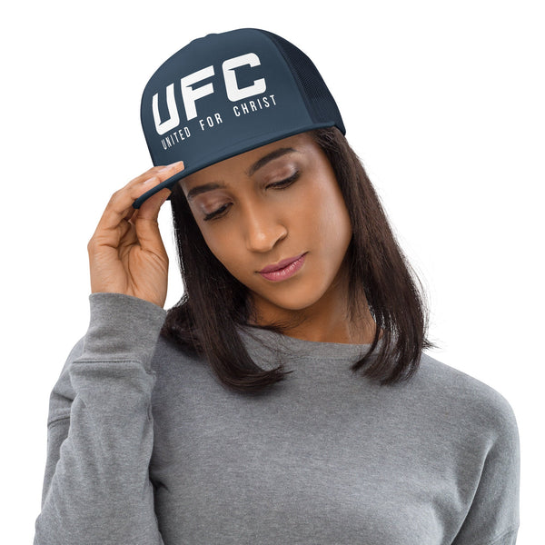 Woman wearing navy UFC United for Christ trucker cap